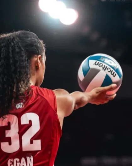 Grace Egan, from Sterling, Illinois, preparing to serve in her number 32 jersey