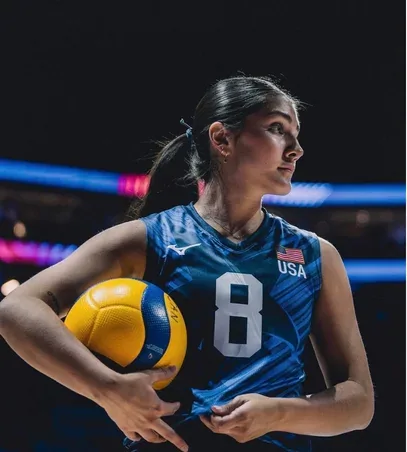 Lexi Rodriguez, from Sterling, Illinois, holding a volleyball in her USA number 8 jersey